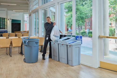 A person throwing rubbish in Brute Bins