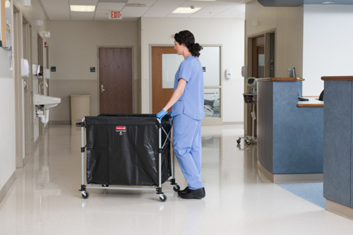 A staff pushing the Rubbermaid X-Cart