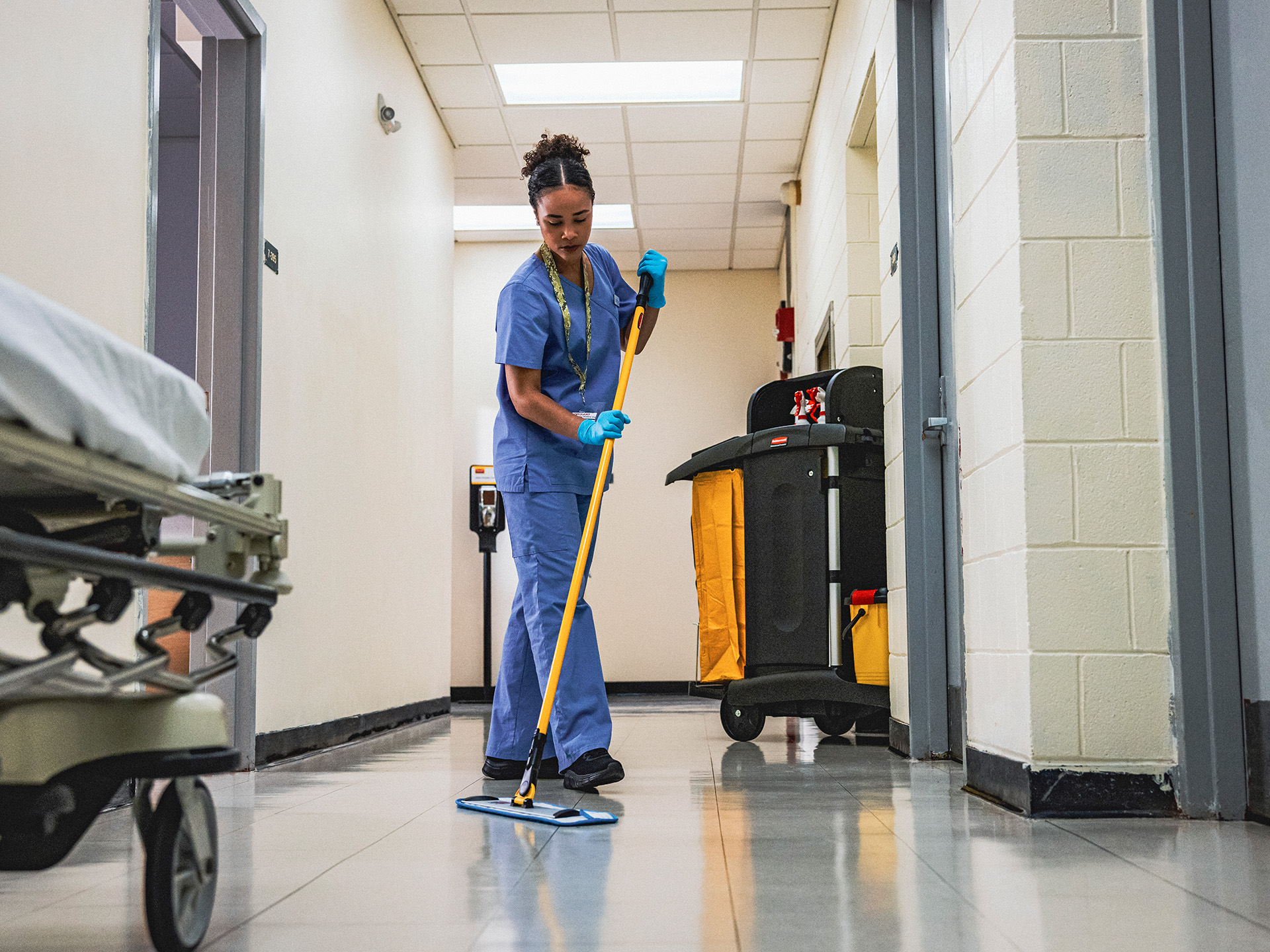 Woman mopping floor.